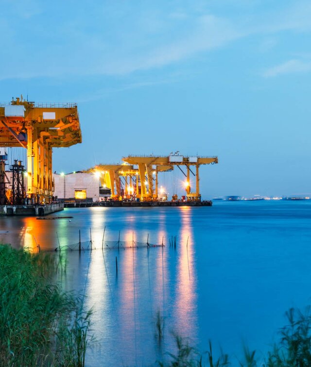 Port container cranes at dusk