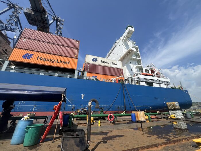Container vessel alongside dock during a marine survey